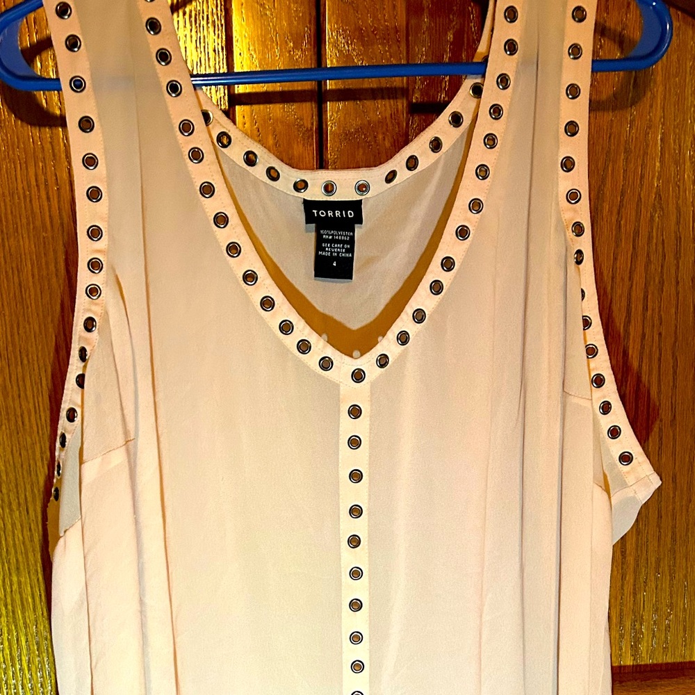 Tank top, very sheer cute tank with metal eyelets surrounding the v-neck